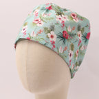 Floral On Teal scrub cap shown on mannequin head