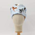 Dog Toss On Light Blue scrub cap pattern detail on mannequin