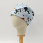 Dog Toss On Light Blue scrub cap shown on mannequin head