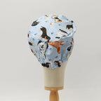 Dog Toss On Light Blue scrub cap shown on mannequin head