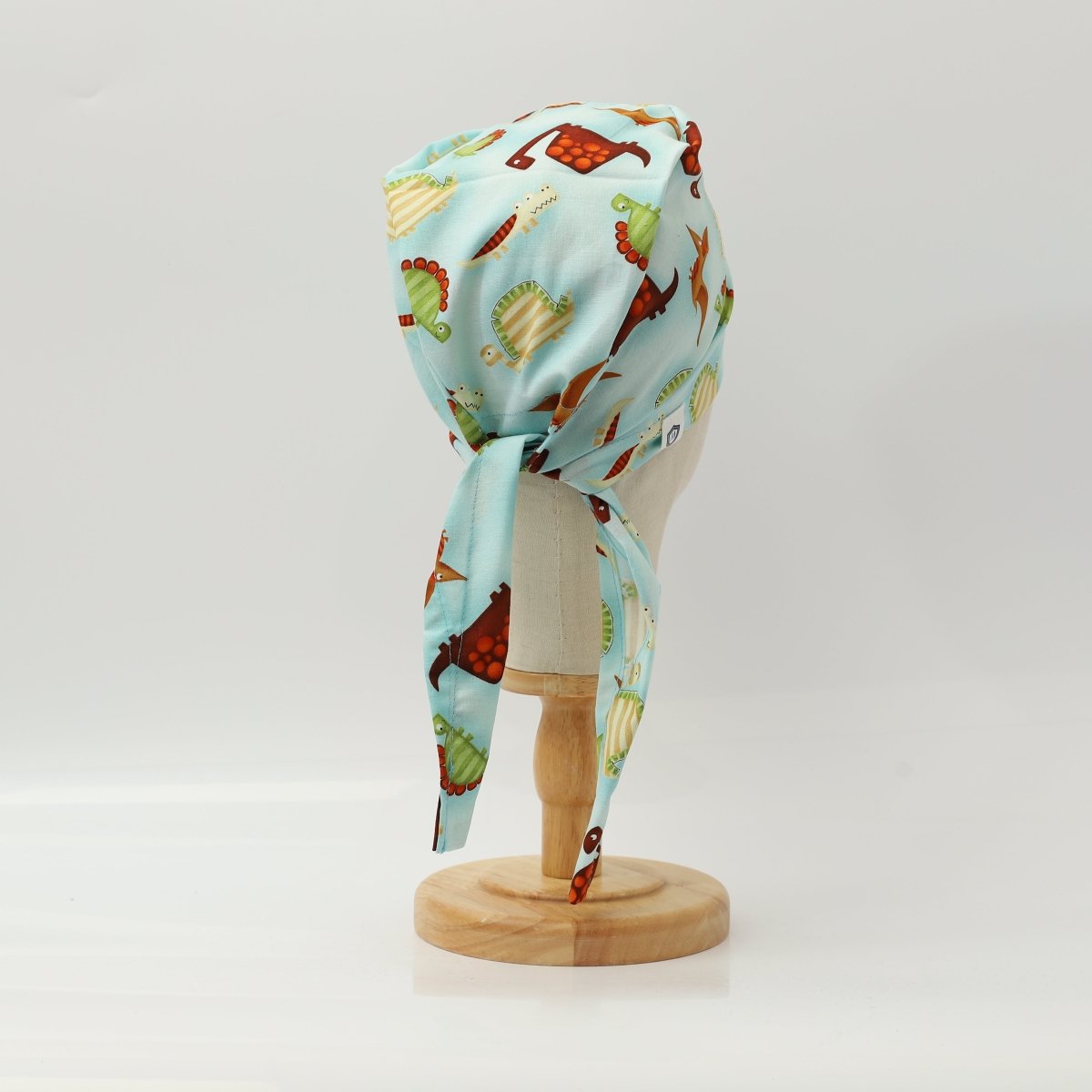Dinosaurs in a Swamp Light Blue Scrub Cap