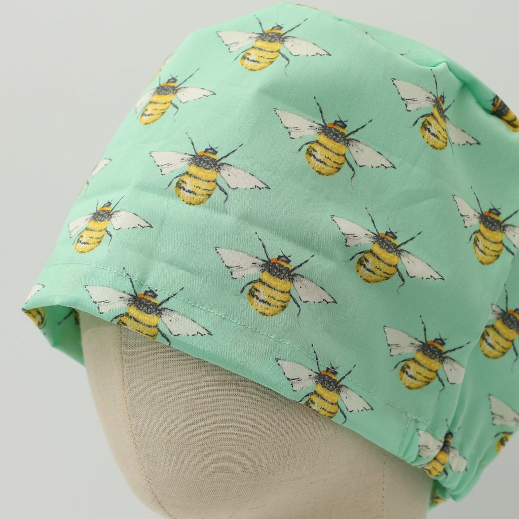 Gorro quirúrgico con abejas en color verde azulado