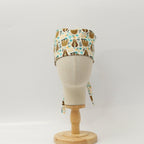 Back view of pun-tastic scrub cap featuring cute sloths and blue flowers on cream background