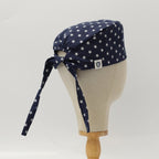 Side view of USA Stars On Navy scrub cap showing white star pattern and tie detail
