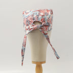 Back view of Skeleton 3D Vision scrub cap showing colorful anatomical pattern and tie closure details