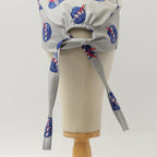 Back view of Space NASA logos circles scrub cap showing tie closure detail on mannequin