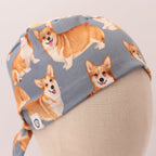 Close-up side view of Royal Corgi Dogs scrub cap showing orange corgi pattern on gray fabric