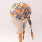 Royal Corgi Dogs scrub cap side profile showing orange corgi pattern on gray fabric with tie detail