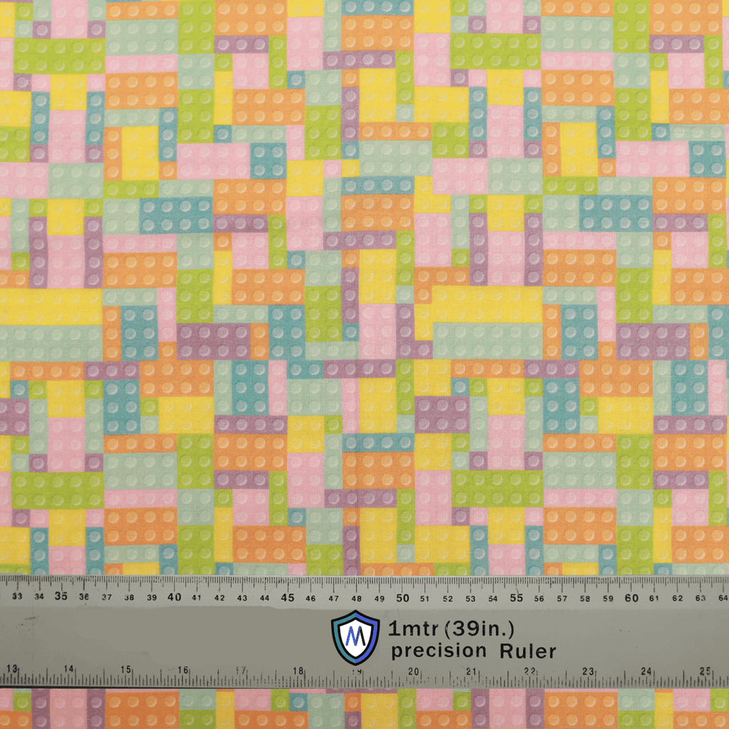 Fabric sample with pastel-colored LEGO and Tetris-inspired pattern, designed for Medicus Scrub Caps. A 1-meter ruler at the bottom provides scale.