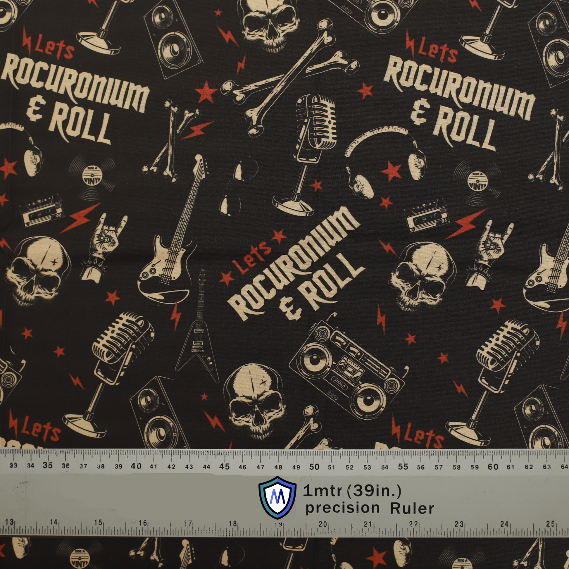 Fabric sample for Medicus Scrub Caps with "Let's ROCURONIUM & ROLL" text, rock-themed illustrations, and a 1-meter ruler at the bottom for scale.