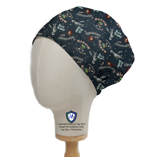 A mannequin head wears the Medicus Scrub Caps Looney Tunes Scrub Cap, featuring Marvin, Taz, and Bugs on a dark blue space-themed background for a fun surgical look.