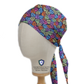 Side view of a mannequin wearing the Love Drug Candy Scrub Cap by Medicus Scrub Caps, featuring colorful pill-inspired skull designs with medical text.