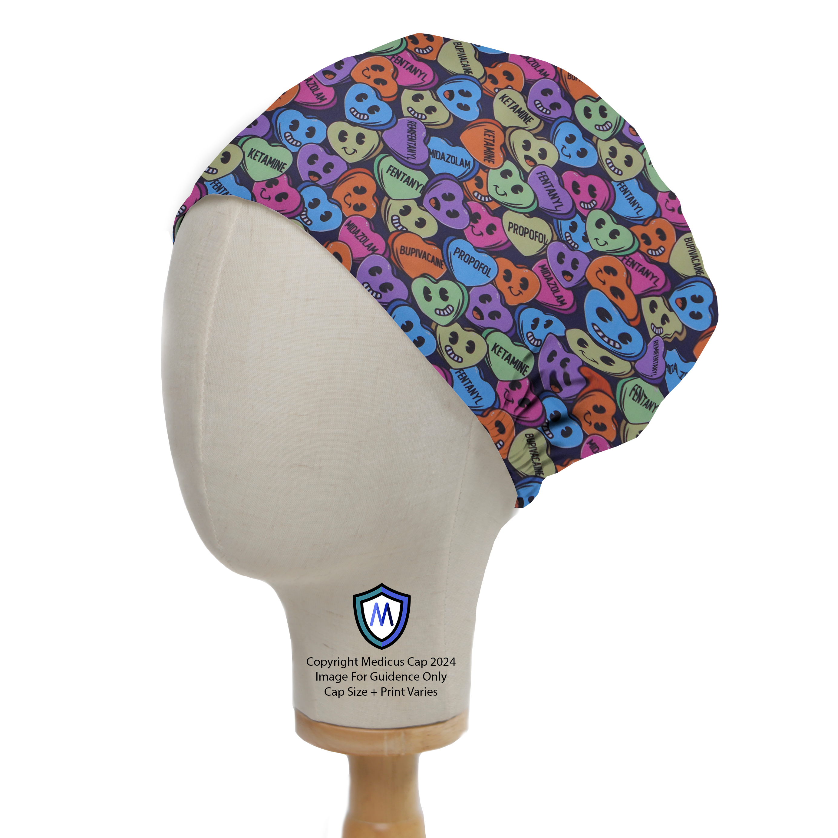 The Love Drug Candy Scrub Cap by Medicus Scrub Caps features colorful, playful skull motifs and medication names, displayed on a mannequin against a white background.