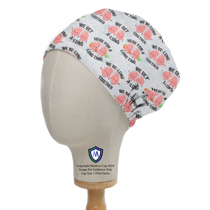 Lung Puns Be-Lung Together Scrub Cap from Medicus Scrub Caps, featuring cute lung-themed illustrations and puns on a white background.