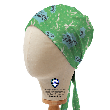 Green Medicus Scrub Cap with "Make it Snappy" text, scissors, and snap-themed design. Bandana style with ties at the back. #make-it-snappy-scrub-cap
