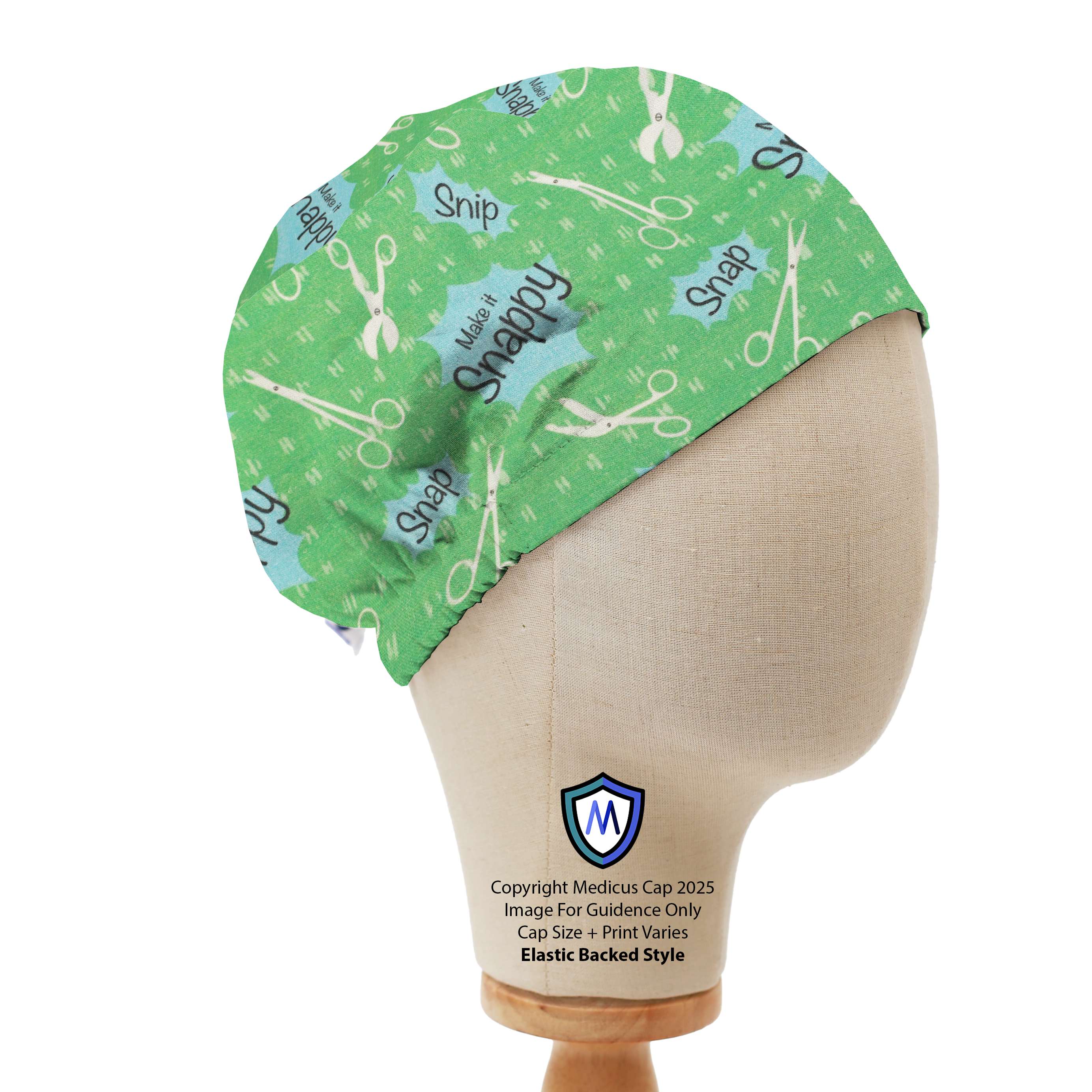 Green Medicus Scrub Cap with a "Make it Snappy" scissors pattern, displayed on a mannequin. Elastic-backed style for a secure fit.