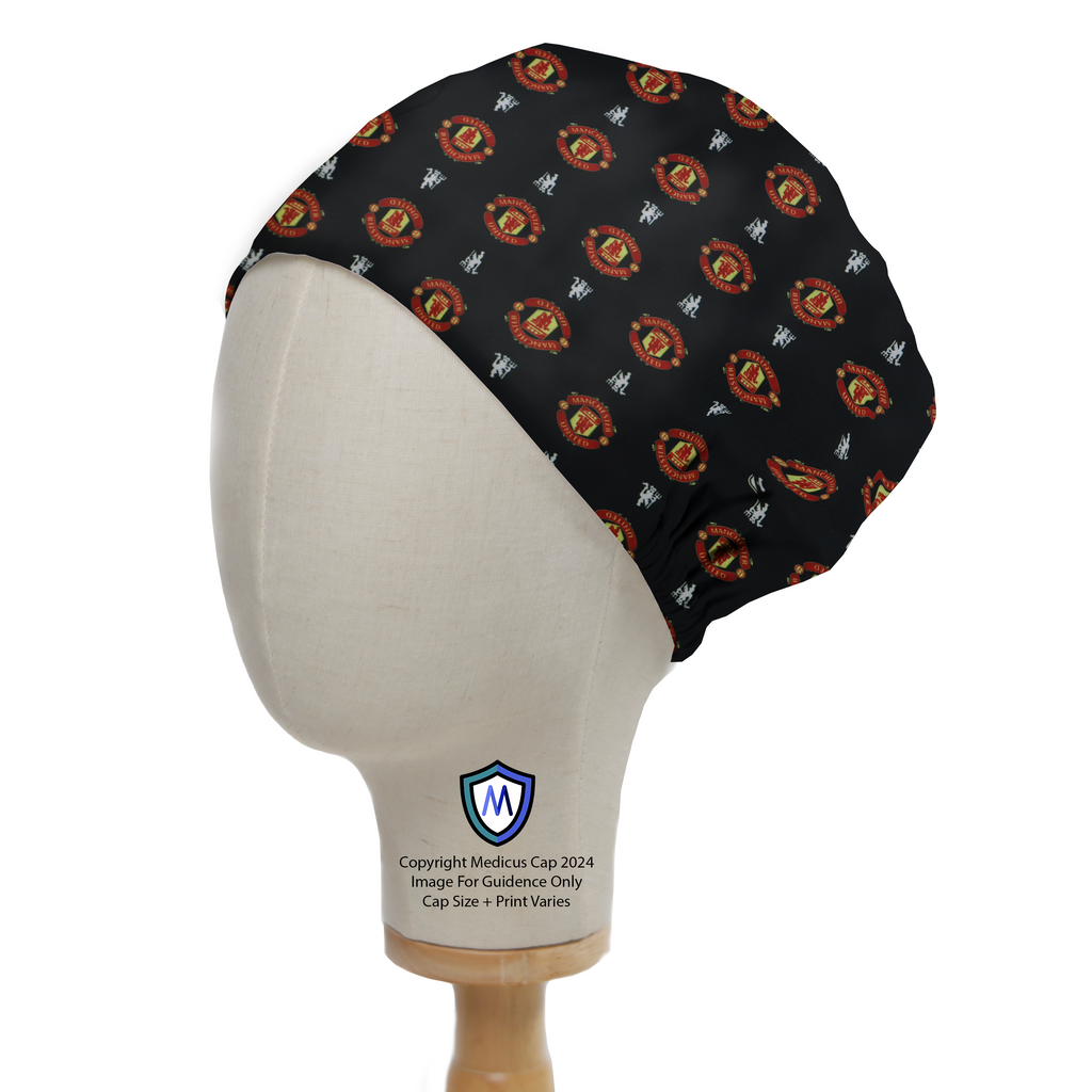 The Football Club Manchester United Black Scrub Cap by Medicus Scrub Caps, featuring a vibrant pattern of logos and symbols, displayed on a mannequin head.