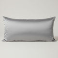 Silver gray satin pillowcase displayed on a light gray background, showing smooth silky fabric texture