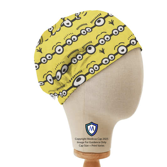 Elastic-backed yellow scrub cap with a Minions eyes pattern by Medicus Caps, displayed on a mannequin, showcasing its fun and playful design.