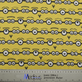 Fabric pattern with Minions eyes on a yellow background by Medicus Caps, designed for fun and playful scrub caps.