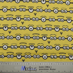 Fabric pattern with Minions eyes on a yellow background by Medicus Caps, designed for fun and playful scrub caps.