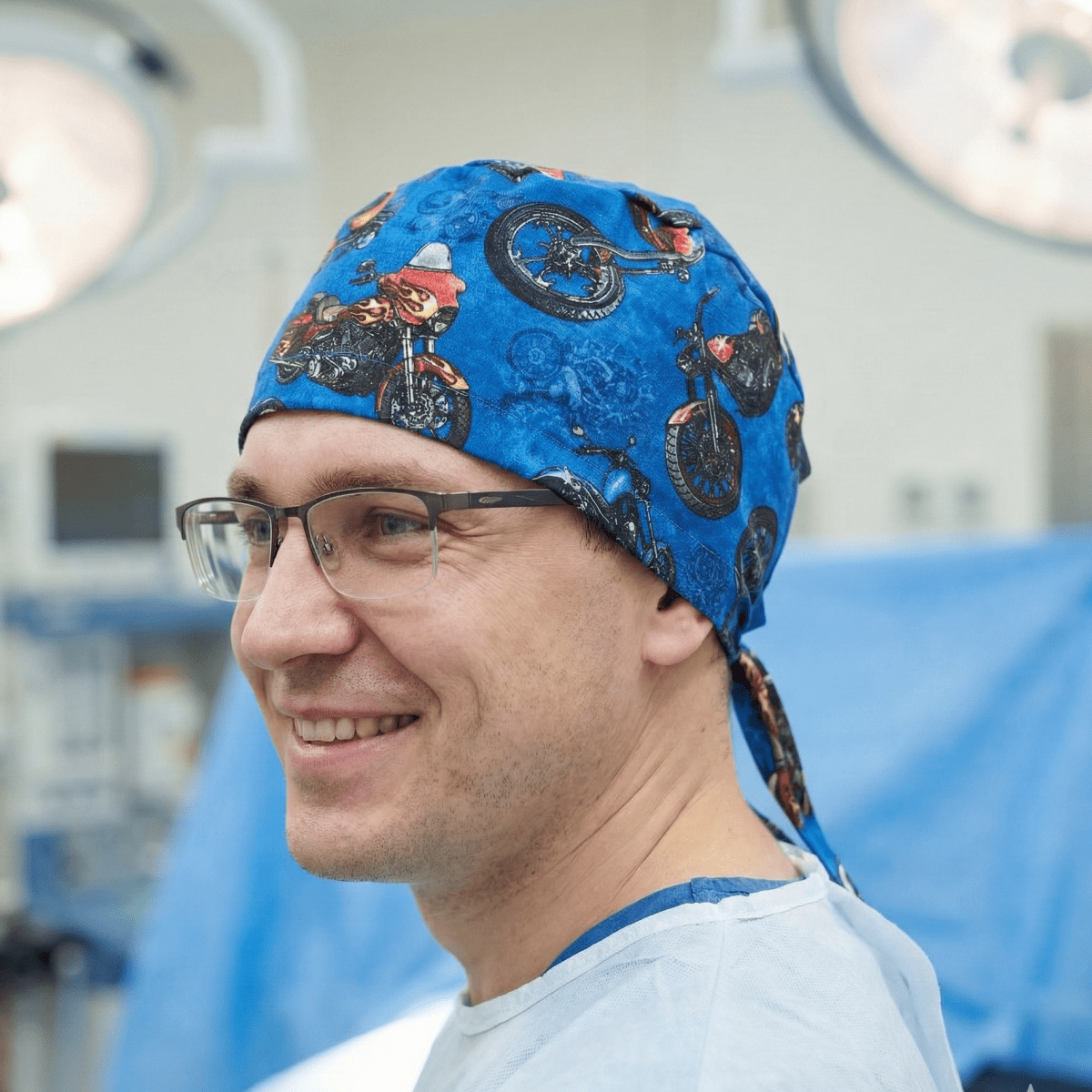 Dark blue motorcycle pattern scrub cap with vintage bike prints and tie-back design