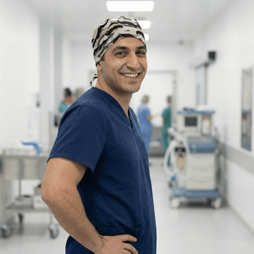 Healthcare professional wearing Moustache Madness scrub cap with black mustache pattern on gray background