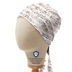 Music sheet patterned scrub cap in off-white shown on mannequin head side profile view