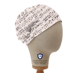 Music sheets pattern scrub cap in black and off-white shown on mannequin head side view