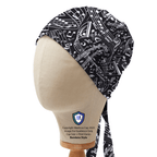 Side profile view of black and white music sheets pattern scrub cap on mannequin head