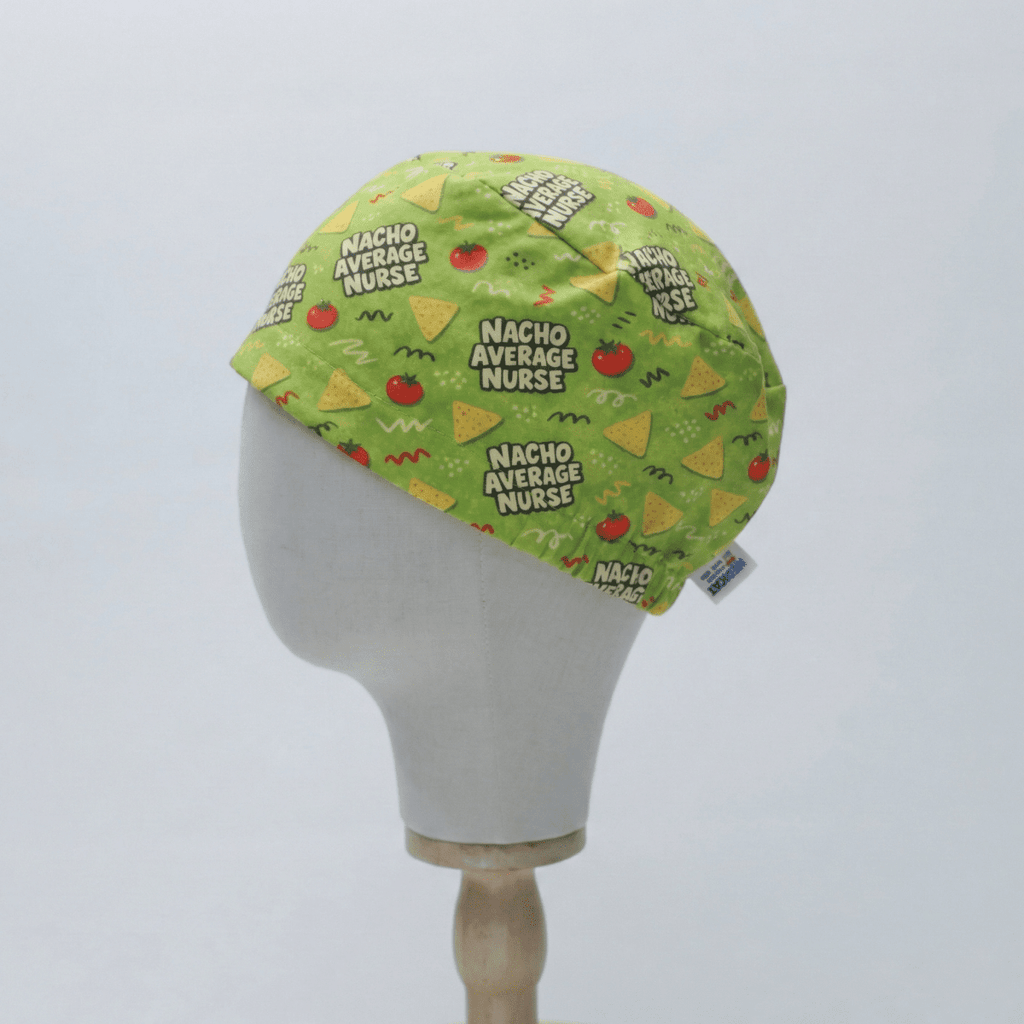 Green scrub cap with "Nacho Average Nurse" text and avocado pattern shown on mannequin head