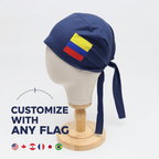 Navy blue scrub cap with Colombian flag patch shown on mannequin head, side profile view