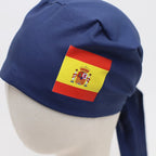 Navy scrub cap with Spanish flag vinyl transfer patch showing red, yellow colors and coat of arms