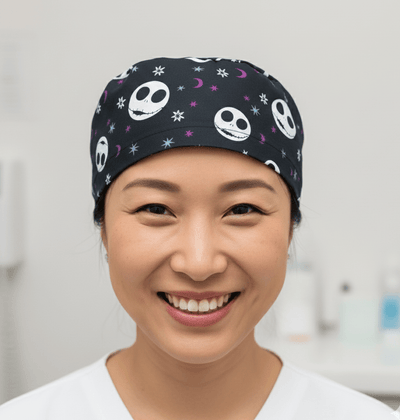 Black scrub cap with white skull faces and purple stars nightmare pattern