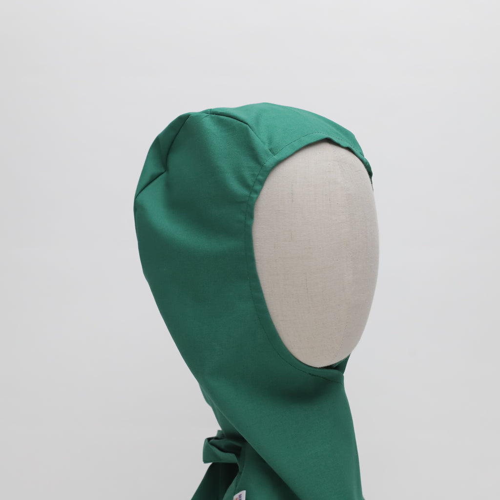 A mannequin wearing a green Medicus Orthopaedic Surgical Hood Scrub Cap, designed for protection and comfort. Covers the head, leaving the face open. 22+ colors available.