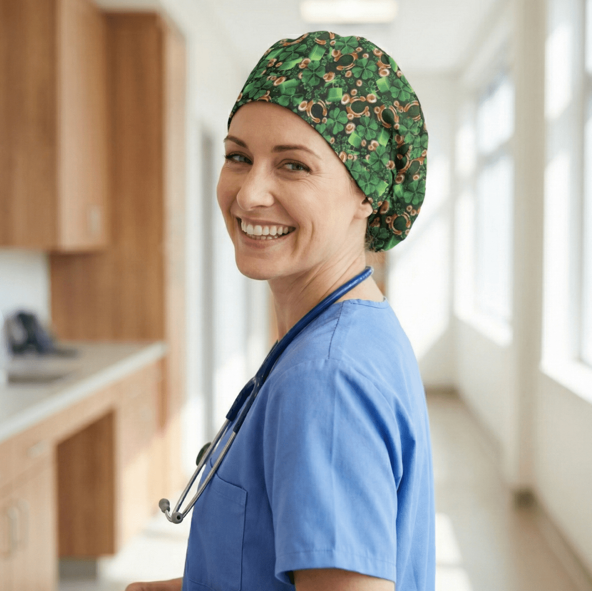 Side profile of healthcare worker wearing green shamrock patterned scrub cap with smile