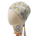 Mannequin head wearing a Medicus Scrub Cap featuring Pikachu on pink-lined fabric, bandana style.