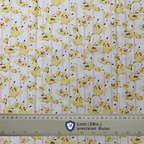 Fabric sample with Pikachu and lightning bolts on a pink-striped background, used for Medicus Scrub Caps. 1-meter ruler included for scale.