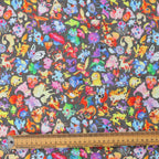 Close-up detail of colorful Pokemon characters pattern on kawaii style scrub cap fabric with measuring ruler