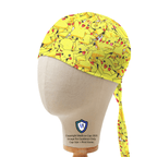 Yellow Pikachu patterned scrub cap shown on mannequin head displaying side profile and tie detail
