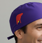 Purple scrub cap with red cardinal bird vinyl transfer design, side profile view