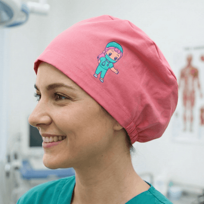 Pink scrub cap with cute medical cartoon character design for healthcare professionals