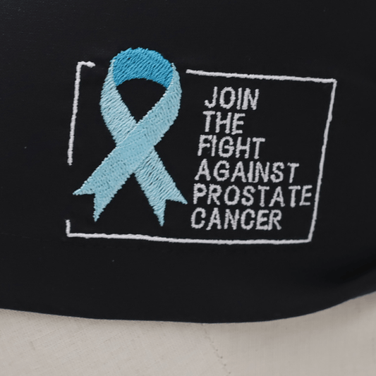 Black Medicus Scrub Cap with embroidered blue ribbon and "Join the Fight Against Prostate Cancer" message, supporting prostate cancer awareness.