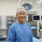 Healthcare professional wearing patterned scrub cap with "Born To Be Mild" text design in operating room