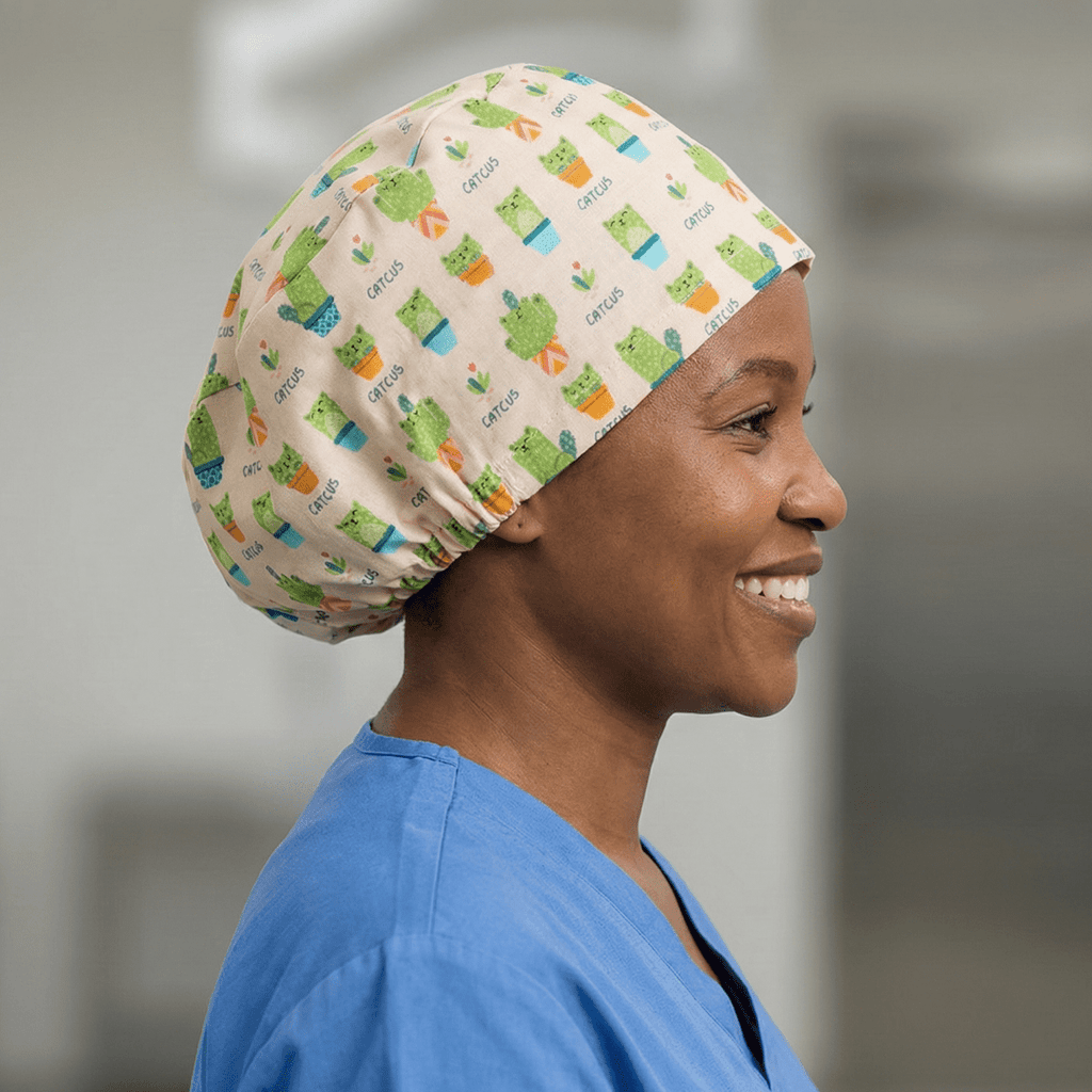Colourful cactus pattern scrub cap with green succulents and plant pots on cream background