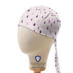 Purple Rain Drops scrub cap with white background and purple teardrop pattern, side view on mannequin head