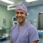 Healthcare professional wearing purple Pokemon Go scrub cap with colorful character pattern, front view in operating room