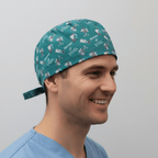 Teal green robotic surgery themed scrub cap with nerves of steel medical pattern