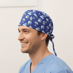 Purple scrub cap with white robot pattern worn by smiling healthcare professional
