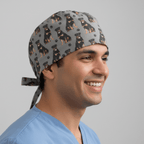 Grey scrub cap with black tan Rottweiler dog pattern and paw prints tie-back design